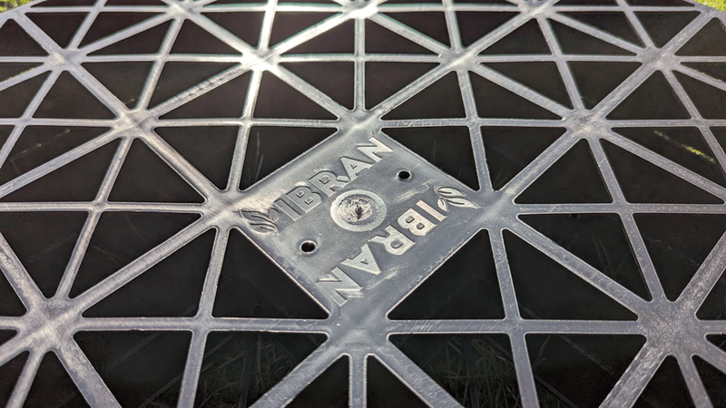 Load image into Gallery viewer, Underneath the free draining grass grids made by IBRAN