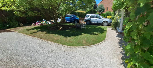 Driveway with stones held by honeycomb gravel grids