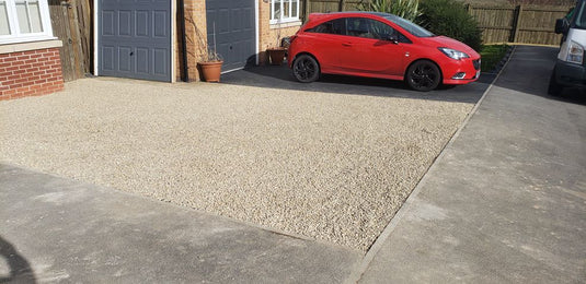 Customer driveway installed with gravel parking grids